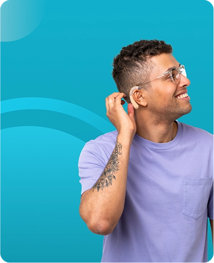 Image depicting a person with a hearing aid or gesture of listening against a teal background, representing audio accessibility features for individuals with hearing impairments.